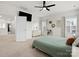 Spacious bedroom with a ceiling fan, TV, and plenty of natural light from the window at 3008 Quinebaug Rd, Fort Mill, SC 29715