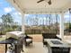 Covered patio with grill, seating area, and string lights, perfect for outdoor entertaining at 3008 Quinebaug Rd, Fort Mill, SC 29715