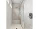 Walk-in shower featuring neutral tiles, a built-in bench, and modern shower fixtures at 3008 Quinebaug Rd, Fort Mill, SC 29715