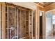 Framed bathroom space showing insulation, plumbing, and the rough layout for a tub and shower install in new construction at 341 Bynum Ave, Rock Hill, SC 29732