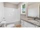 Bathroom featuring a granite-topped vanity, new fixtures, and a shower-tub combination at 341 Bynum Ave, Rock Hill, SC 29732