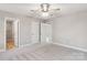 Spacious bedroom with multiple closets, neutral paint, carpet and ceiling fan at 341 Bynum Ave, Rock Hill, SC 29732