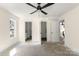 Bright bedroom with ceiling fan, neutral walls, and open doorways at 341 Bynum Ave, Rock Hill, SC 29732