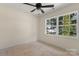 Bedroom with a ceiling fan and large window providing lots of natural light at 341 Bynum Ave, Rock Hill, SC 29732