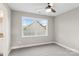 Neutral bedroom offers a ceiling fan, plush carpet, and natural light at 341 Bynum Ave, Rock Hill, SC 29732