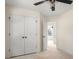Bedroom featuring a ceiling fan, double closet, and doorway to hallway at 341 Bynum Ave, Rock Hill, SC 29732