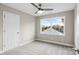 Cozy bedroom offers natural light, neutral walls, carpet, and ceiling fan at 341 Bynum Ave, Rock Hill, SC 29732