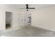 Spacious bedroom with ceiling fan, neutral walls, and multiple doorways providing easy access at 341 Bynum Ave, Rock Hill, SC 29732