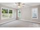 Bright bedroom with large windows, carpet, and a ceiling fan at 341 Bynum Ave, Rock Hill, SC 29732