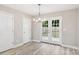 Bright dining room with French doors leading to the backyard and a modern chandelier at 341 Bynum Ave, Rock Hill, SC 29732