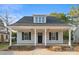 Charming single-story home featuring a welcoming front porch with elegant columns and a well-manicured lawn at 341 Bynum Ave, Rock Hill, SC 29732
