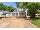 Charming newly constructed house with light gray siding, white trim, a covered front porch, and a pristine front yard at 341 Bynum Ave, Rock Hill, SC 29732