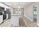 Modern kitchen featuring granite countertops, stainless steel appliances, and bright lighting over the island at 341 Bynum Ave, Rock Hill, SC 29732