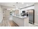 Modern kitchen featuring granite countertops, stainless steel appliances, and bright lighting over the island at 341 Bynum Ave, Rock Hill, SC 29732