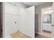 Spacious laundry room with wire rack shelving, door to walk-in closet, and bathroom access at 341 Bynum Ave, Rock Hill, SC 29732
