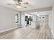 Open-concept living space with hardwood floors that seamlessly connects the living room to the kitchen island at 341 Bynum Ave, Rock Hill, SC 29732