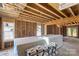 Unfinished living room with exposed beams, studs, and windows showing construction progress at 341 Bynum Ave, Rock Hill, SC 29732