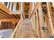 Interior view of wooden staircase under construction, framed by exposed beams, leading to the upper level of the house at 341 Bynum Ave, Rock Hill, SC 29732