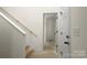 View of stairway with wooden handrail leading to doorway of unfinished room at 341 Bynum Ave, Rock Hill, SC 29732