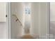 Bright stairway with natural wood railing and a view of a door leading outside at 341 Bynum Ave, Rock Hill, SC 29732