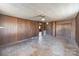 A spacious bedroom with wood paneling, a ceiling light, and wood floors at 3467 Clearview Ln, Maiden, NC 28650