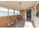 Bright sunroom featuring lots of windows, wood floors, and access to an attached room at 3467 Clearview Ln, Maiden, NC 28650