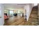 Open concept living room with fireplace and modern furniture, staircase to the right at 3736 13Th Ne St, Hickory, NC 28601