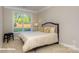 Bright bedroom featuring a large window, neutral paint, plush carpet, and a comfortable bed at 113 Asmodean Ln, Troutman, NC 28166