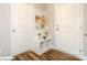View of the entryway with modern floors, a small bench and decorative art on the wall at 113 Asmodean Ln, Troutman, NC 28166