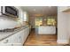 Modern kitchen featuring stainless steel appliances, granite countertops and white cabinets and tile backsplash at 113 Asmodean Ln, Troutman, NC 28166