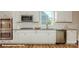 Modern kitchen featuring white cabinets, subway tile backsplash, stainless steel appliances, and granite countertops at 113 Asmodean Ln, Troutman, NC 28166