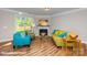 Bright living room with large windows, cozy seating, a fireplace and modern decor at 113 Asmodean Ln, Troutman, NC 28166