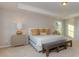 Main bedroom features neutral tones, tray ceilings, and large windows at 113 Asmodean Ln, Troutman, NC 28166