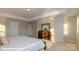 Spacious main bedroom featuring neutral tones and tray ceilings at 113 Asmodean Ln, Troutman, NC 28166