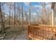 Enjoy outdoor living on this wooden deck, perfect for relaxing while overlooking the natural wooded backyard at 3944 Wade E Morgan Rd, Charlotte, NC 28269
