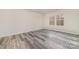 Bedroom with neutral walls, two windows for natural light, and wood-look floors at 3944 Wade E Morgan Rd, Charlotte, NC 28269