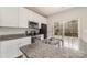 Modern kitchen features white cabinets, granite countertops, and stainless steel appliances at 3944 Wade E Morgan Rd, Charlotte, NC 28269