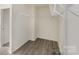 Walk-in closet features built-in shelving and wood look flooring at 411 Wintergreen Ct # 2, Kings Mountain, NC 28086