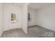 Bright foyer with white trim, grey flooring, and a view to the outside at 411 Wintergreen Ct # 2, Kings Mountain, NC 28086