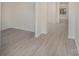 Open hallway with light gray flooring and white walls, leading to other rooms at 411 Wintergreen Ct # 2, Kings Mountain, NC 28086