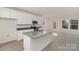 Stylish kitchen featuring an island with a sink, stainless steel appliances, and granite countertops at 411 Wintergreen Ct # 2, Kings Mountain, NC 28086