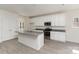 Bright kitchen featuring stainless steel appliances, granite countertops, and a center island at 411 Wintergreen Ct # 2, Kings Mountain, NC 28086