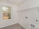 Laundry room with window, shelving, and washer and dryer hookups at 411 Wintergreen Ct # 2, Kings Mountain, NC 28086
