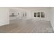 Spacious living area with new floors, abundant natural light, and a view of the open kitchen at 411 Wintergreen Ct # 2, Kings Mountain, NC 28086