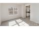 Bright living room featuring light grey floors and views to the white kitchen at 411 Wintergreen Ct # 2, Kings Mountain, NC 28086