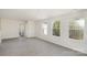 Bright room with three windows, neutral walls, and hardwood floors at 411 Wintergreen Ct # 2, Kings Mountain, NC 28086