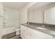 Bathroom featuring granite counters, dual sinks, vanity cabinet, mirror and shower-tub combo at 418 Wintergreen Ct, Kings Mountain, NC 28086