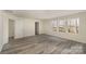 Bedroom with three windows and hardwood flooring, offering a view of the outdoors at 418 Wintergreen Ct, Kings Mountain, NC 28086