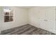 Bedroom featuring a window for natural light and a closet with folding doors at 418 Wintergreen Ct, Kings Mountain, NC 28086