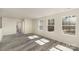 Bright room with wood-look floors and large windows providing natural light and views of the outdoors at 418 Wintergreen Ct, Kings Mountain, NC 28086